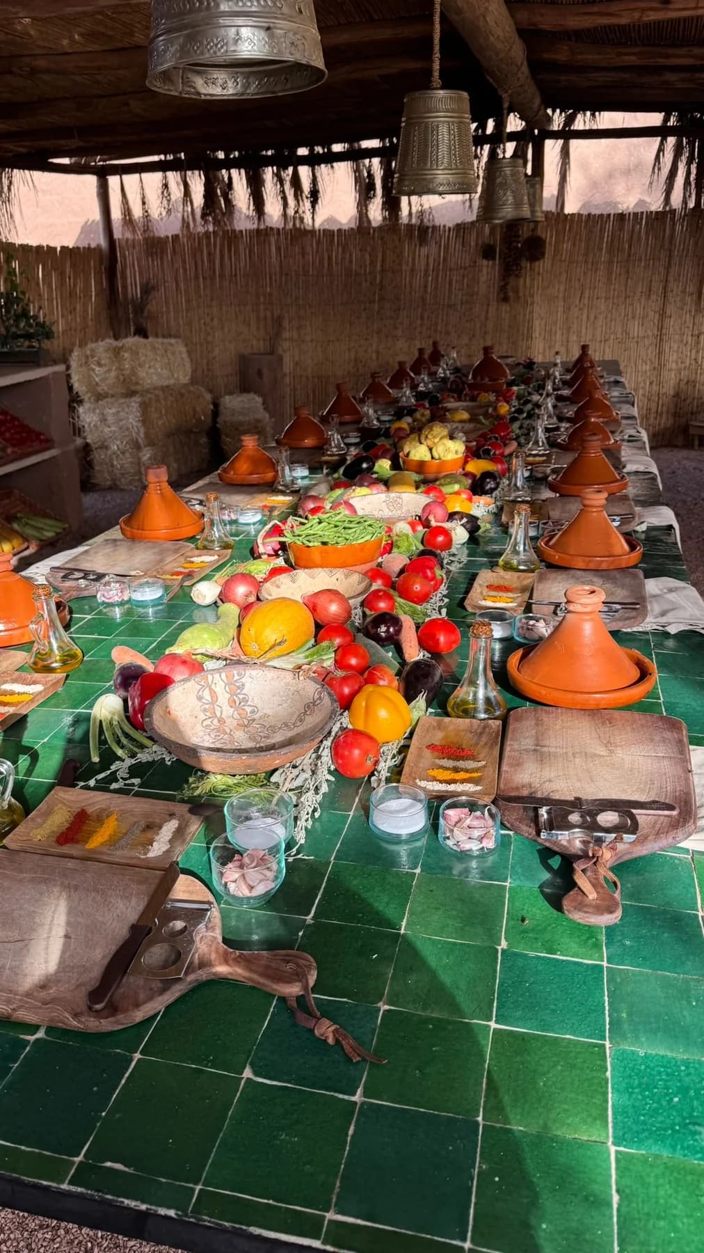 Tagine pots and ingredients arranged on a cooking table